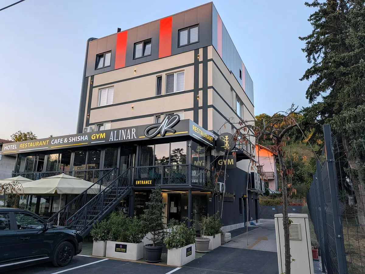 The building in Dobrinja, Sarajevo, with the Alinar sign and the entrance to GymAlinar women's gym
